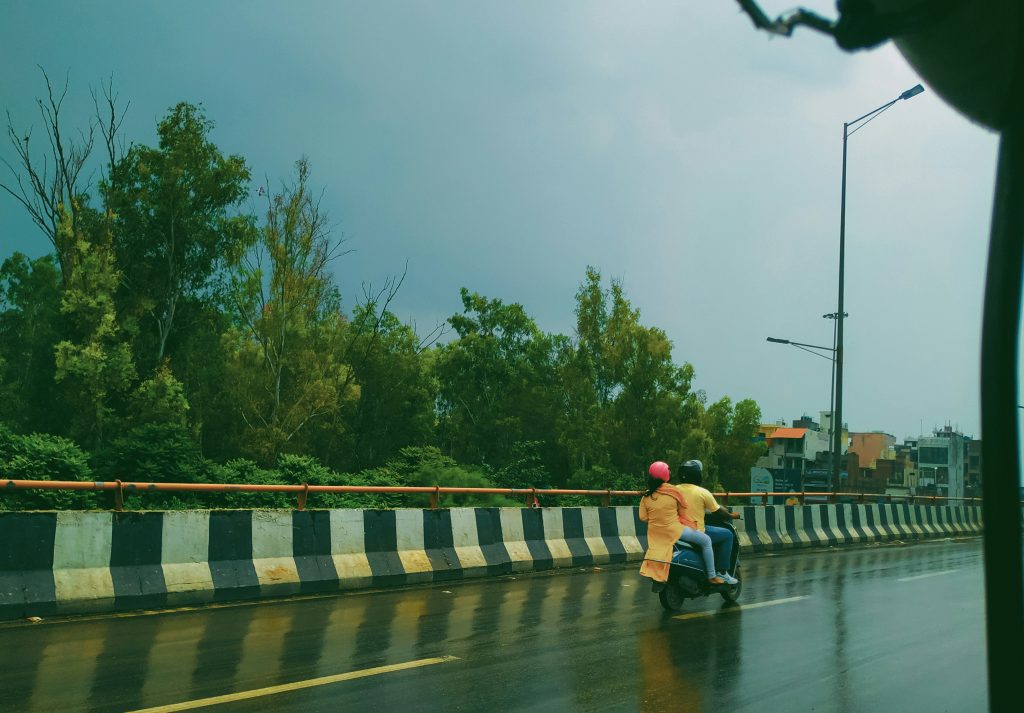 Flooded street in Hyderabad during monsoon with traffic
